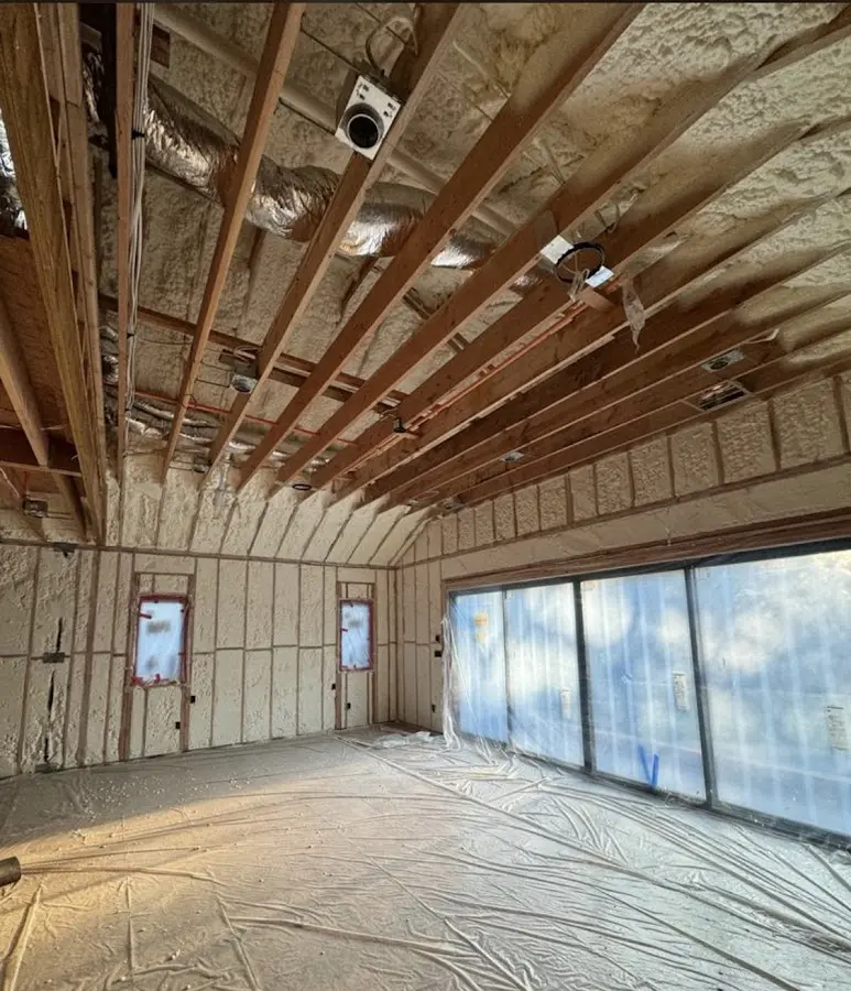 Interior walls and ceiling insulated with spray foam during new construction in Cliffside Park